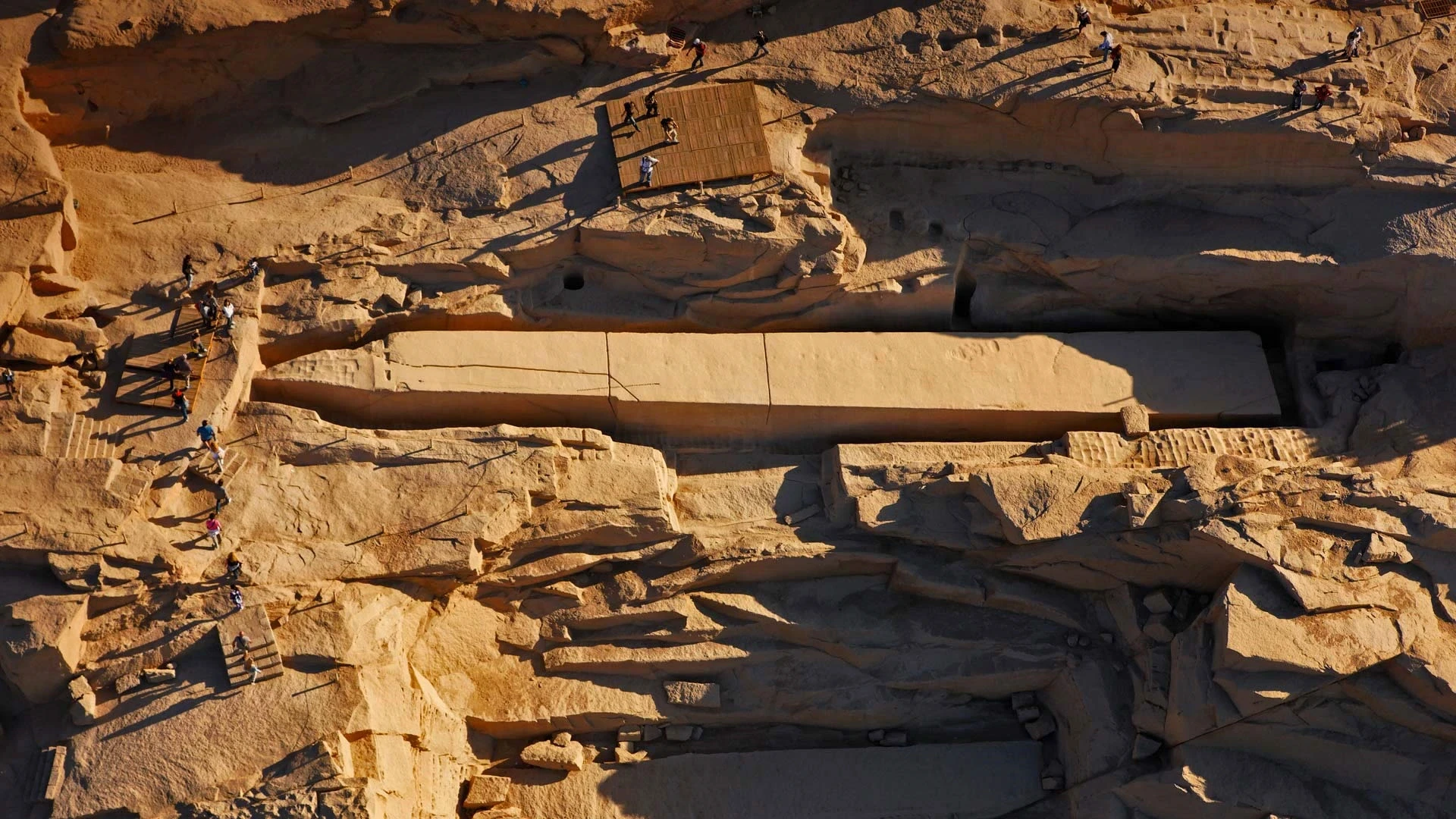 Visitors exploring the Unfinished Obelisk in Aswan Egypt tours