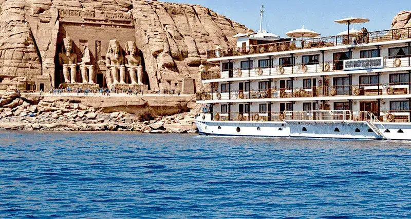 Elegant river cruise vessel traveling through Egypt with views of the Nile Valley